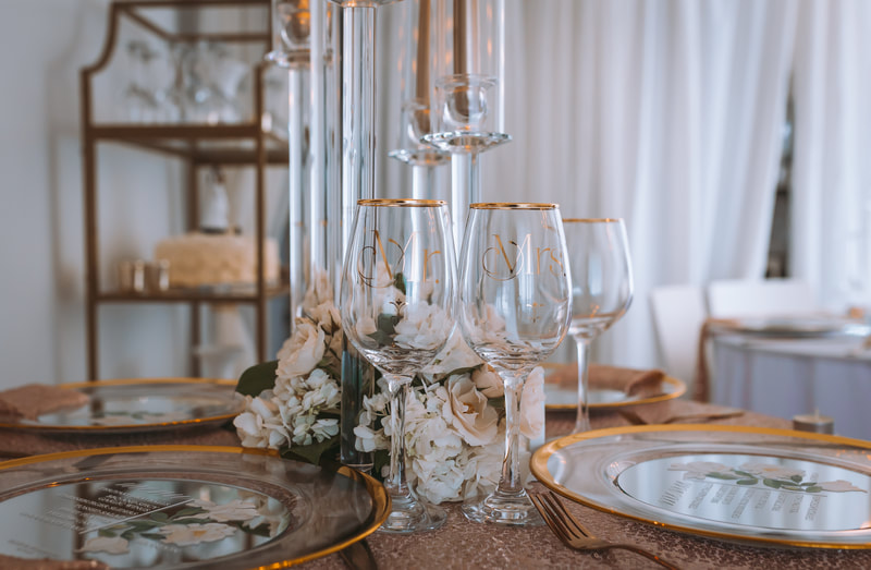 Luxury micro wedding reception place settings with rose gold sequin linens, napkins and flatware. Custom mirrored menus and gold trimmed charger plates.